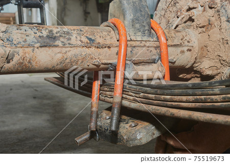 Front View Orange U-Bolt with Bump Stop on Rear Axle and Leaf Spring Front View Orange U-Bolt with Bump Stop on Rear Axle and Leaf Spring 75519673