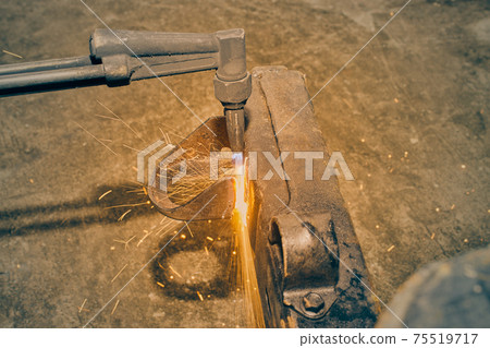 Zoom View Oxygen Acetylene Torch Cutting Car Part with Small Sparkle in Vintage Tone 75519717