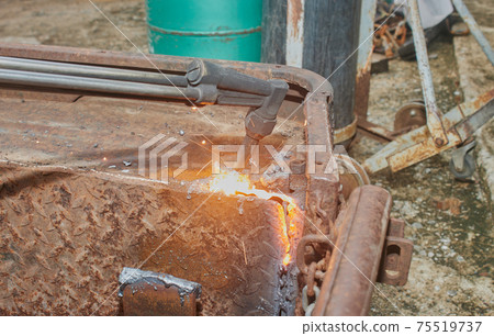 Right View of Car Body Part Removal by Oxygen Acetylene Cutting Torch 75519737