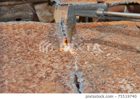 Left View of Checker Plate Cutting by Oxygen Acetylene Cutting Torch and Sparkle 75519740