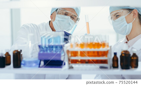 close up. container with test tubes on the table in the laboratory . 75520144