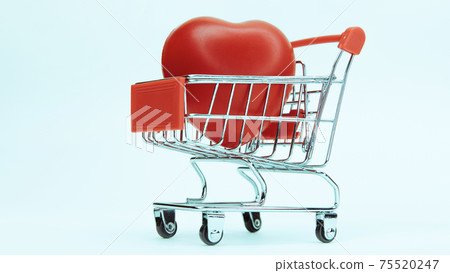 close up. big red heart in a shopping cart. 75520247
