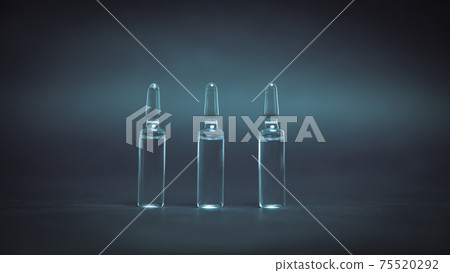 medical glass ampoules on a dark background. medical glass ampoules on a dark background. 75520292