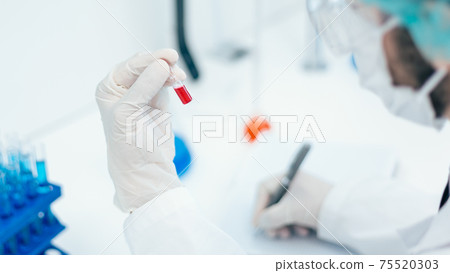 close up. scientists conduct research in the laboratory . 75520303