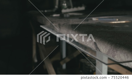 Glass cutting and processing for fireplace doors. Circular glass cutter. Worker cut glass with glass cutting diamond. Glass cutting and processing for fireplace doors. Circular glass cutter. Worker cut glass with glass cutting diamond. 75520446
