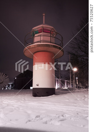 Red white lighthouse tower at winter night. Turku Red white lighthouse tower at winter night. Turku 75520627