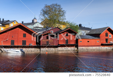 Rural Finnish landscape. Traditional old red houses Rural Finnish landscape. Traditional old red houses 75520640