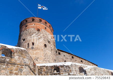 Olavinlinna is under blue sky on a sunny winter day Olavinlinna is under blue sky on a sunny winter day 75520643