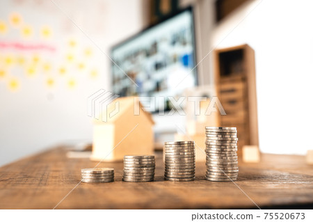 Money coin Grow up business and computer Concept,Silver coins stacked on wooden desks. 75520673