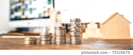 Money coin Grow up business and computer Concept,Silver coins stacked on wooden desks. Money coin Grow up business and computer Concept,Silver coins stacked on wooden desks. 75520679