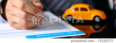 Male arm in suit sign insurance form lying on table Male arm in suit sign insurance form lying on table 75520777