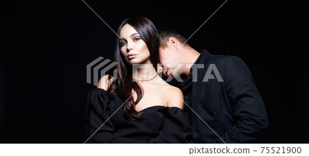 beautiful woman in evening dress with man in a suit 75521900