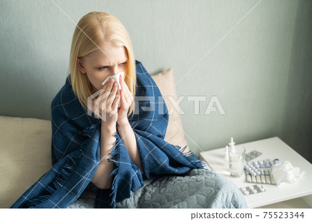 A lot of medicines on night table in bedroom 75523344