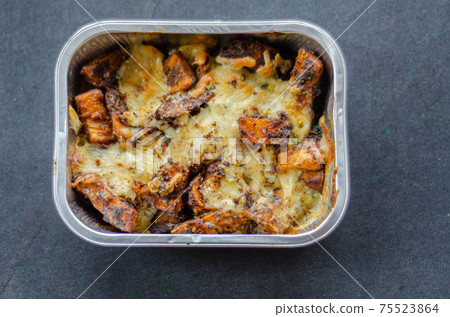 Fried potato fries coated topped with mature cheddar and Monterey Jack cheeses, jalapeno and bacon sauce, finished with mozzarella and parsley Fried potato fries coated topped with mature cheddar and Monterey Jack cheeses, jalapeno and bacon sauce, finished with mozzarella and parsley 75523864
