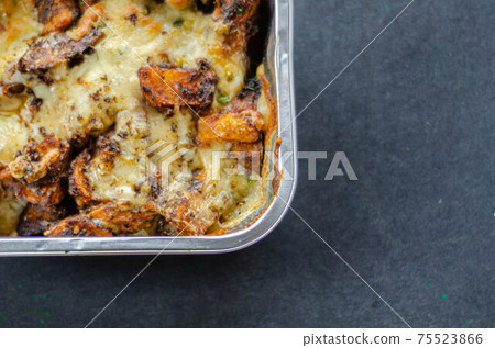 Fried potato fries coated topped with mature cheddar and Monterey Jack cheeses, jalapeno and bacon sauce, finished with mozzarella and parsley Fried potato fries coated topped with mature cheddar and Monterey Jack cheeses, jalapeno and bacon sauce, finished with mozzarella and parsley 75523866