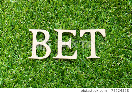 Alphabet letter in word bet on green grass background Alphabet letter in word bet on green grass background 75524338
