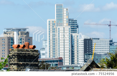 Typical English chimneys on the roofs of London buildings Typical English chimneys on the roofs of London buildings 75524956