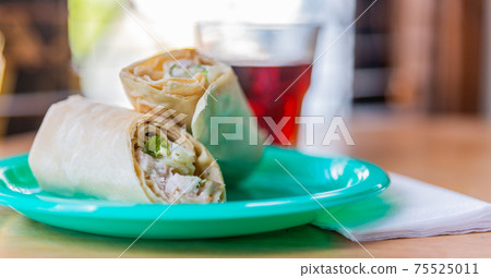 Chicken breast with caesar dressing and lettuce in a gluten-free tortilla wrap 75525011