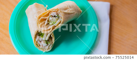 Chicken breast with caesar dressing and lettuce in a gluten-free tortilla wrap 75525014