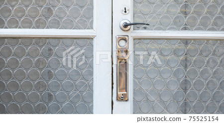 Old letterbox in the door, traditional way of delivering letters to the house, old mailbox Old letterbox in the door, traditional way of delivering letters to the house, old mailbox 75525154