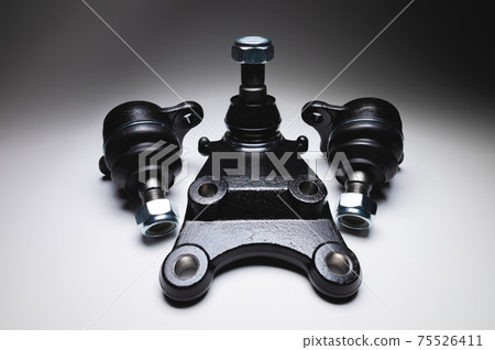 Kit New SUV Front Suspension Ball Joint with Nut on Gray Gradient Background Kit New SUV Front Suspension Ball Joint with Nut on Gray Gradient Background 75526411