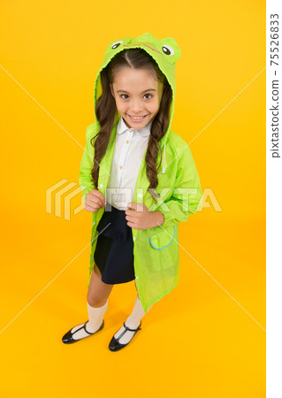 Cute raincoat kids would love. Frog style. Schoolgirl Cute raincoat kids would love. Frog style. Schoolgirl 75526833