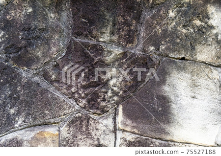Old rotten stone wall with weathered seams. Abstract texture Old rotten stone wall with weathered seams. Abstract texture 75527188