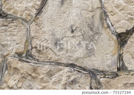 Stone wall with cement seam close-up. Stone wall with cement seam close-up. 75527194
