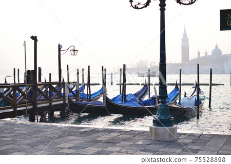 Venetian gondola and church of San Giorgio Maggiore Venetian gondola and church of San Giorgio Maggiore 75528898