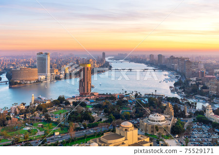 Cairo downtown with Skyscrappers on the Nile at sunset, Egypt Cairo downtown with Skyscrappers on the Nile at sunset, Egypt 75529171