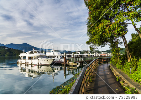 Yachts Marina at Sun Moon Lake in the morning, the famous attraction in Taiwan, Asia. Yachts Marina at Sun Moon Lake in the morning, the famous attraction in Taiwan, Asia. 75529985
