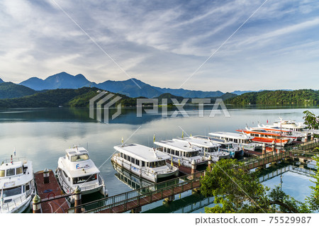Yachts Marina at Sun Moon Lake in the morning, the famous attraction in Taiwan, Asia. Yachts Marina at Sun Moon Lake in the morning, the famous attraction in Taiwan, Asia. 75529987