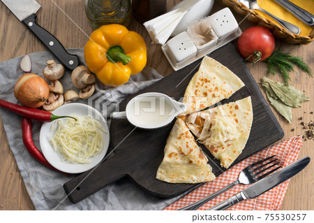Tortilla with sausages, mozzarella cheese and sour cream 75530257