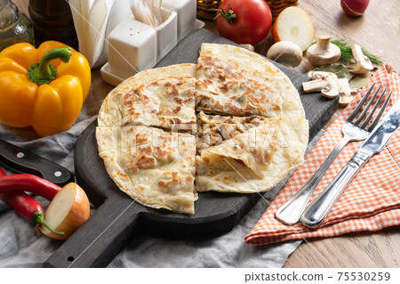 Tortilla with mushrooms and onion 75530259