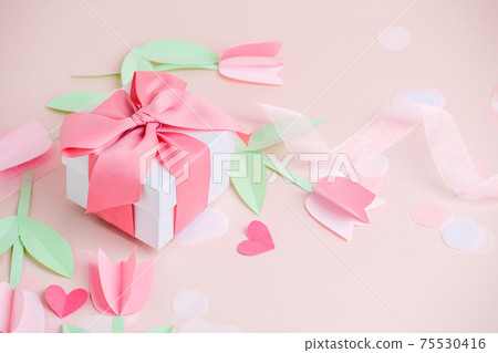Holiday greeting card pink background with gift, Naive paper cut flowers tulips. Valentine's Day, Happy Women's Day, Mother's Day, Birthday, Wedding, space for text, foil baloon, stylish flyer, banner Holiday greeting card pink background with gift, Naive paper cut flowers tulips. Valentine's Day, Happy Women's Day, Mother's Day, Birthday, Wedding, space for text, foil baloon, stylish flyer, banner 75530416
