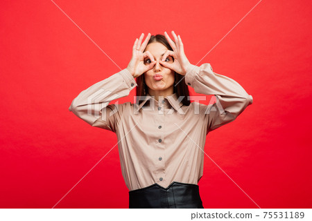 The young emotional angry, scared woman looking at camera.The human emotions, facial expression concept. The young emotional angry, scared woman looking at camera.The human emotions, facial expression concept. 75531189