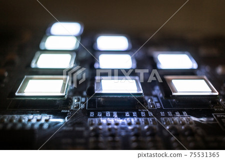 The process of checking several oled displays on the test station. Displays glow brightly. The process of checking several oled displays on the test station. Displays glow brightly. 75531365