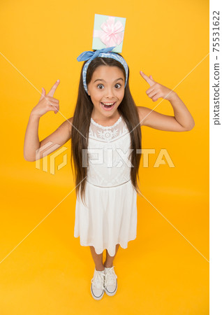 Look here. Girl long hair bandana knot hold gift box.  Look here. Girl long hair bandana knot hold gift box.  75531622