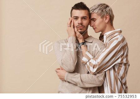 Loving Gay Couple Embracing in Studio Loving Gay Couple Embracing in Studio 75532953