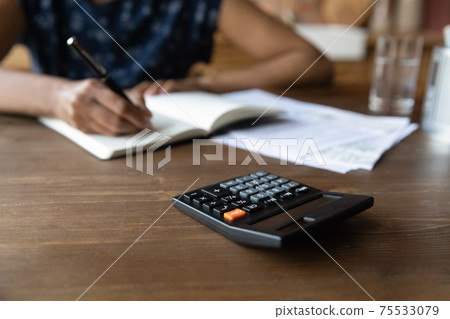 Cropped view of millennial black female work with financial papers Cropped view of millennial black female work with financial papers 75533079