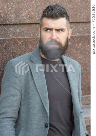 bearded hipster guy with stylish hairdo wear jacket and jeans  75533636