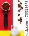 Espresso machine filter with ground coffee, coffee beans and  white cup. 75533678