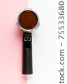 Espresso machine filter with ground coffee. 75533680