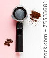 Espresso machine filter, ground coffee and coffee beans. 75533681