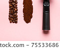 Detail of espresso machine filter, ground coffee and coffee beans. 75533686