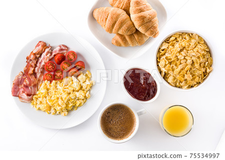 Breakfast with scrambled eggs, bacon, tomatoes,coffee,orange juice ,croissant and corn flakes isolated on white background 75534997