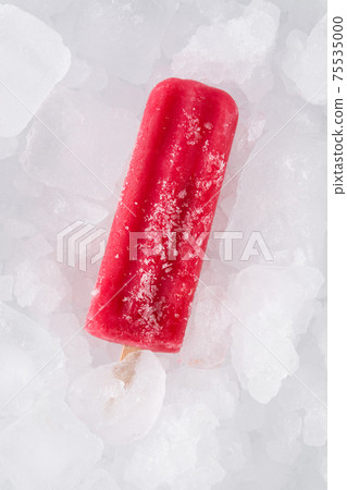 Strawberry popsicle on ice cubes. Top view. Strawberry popsicle on ice cubes. Top view. 75535000