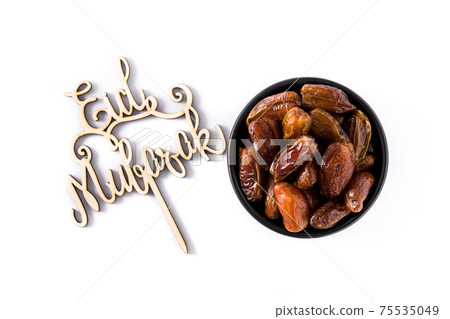 Dates isolated on white background Dates isolated on white background 75535049
