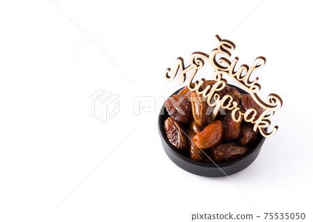 Dates isolated on white background Dates isolated on white background 75535050