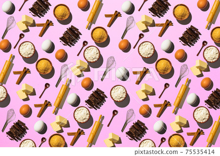Baking background. Pattern of raw ingredients for cooking dessert on pink background. Baking background. Pattern of raw ingredients for cooking dessert on pink background. 75535414